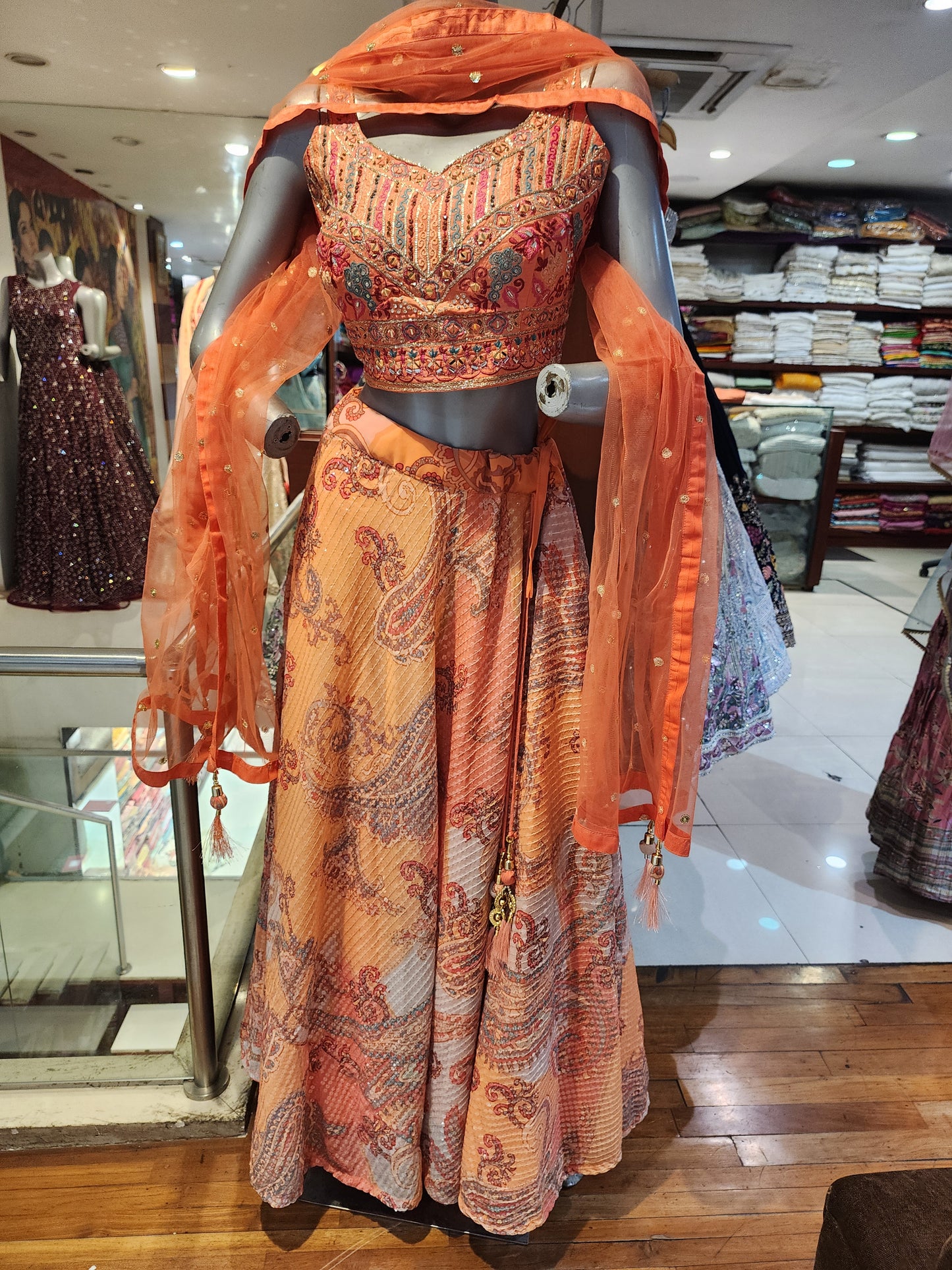 Orange chinon sequins lehenga with embroidered choli ,net dupatta