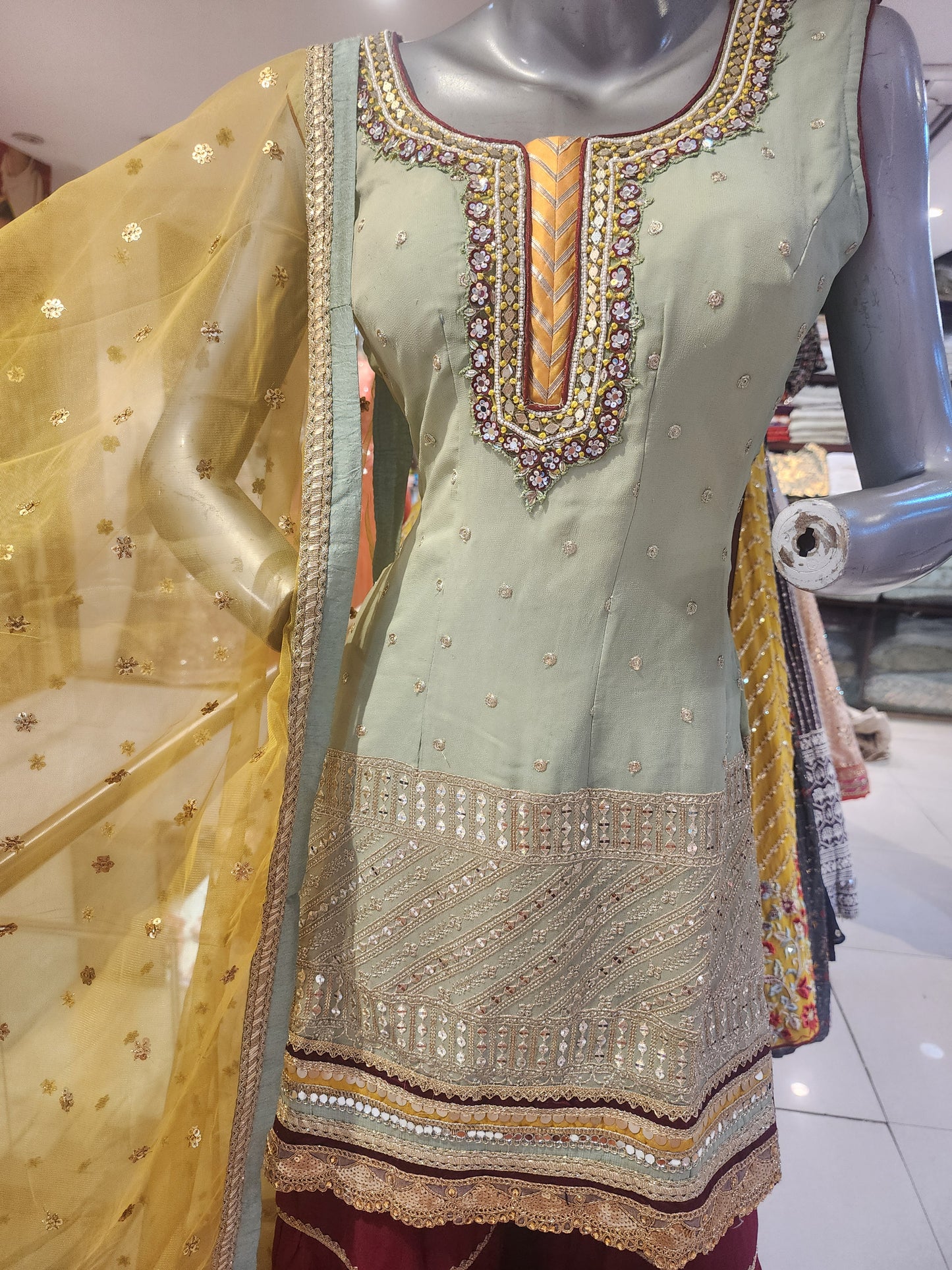 Pista Green georgette shirt Meroon colour garara with yellow net dupatta , hand embroidered neck and machine work