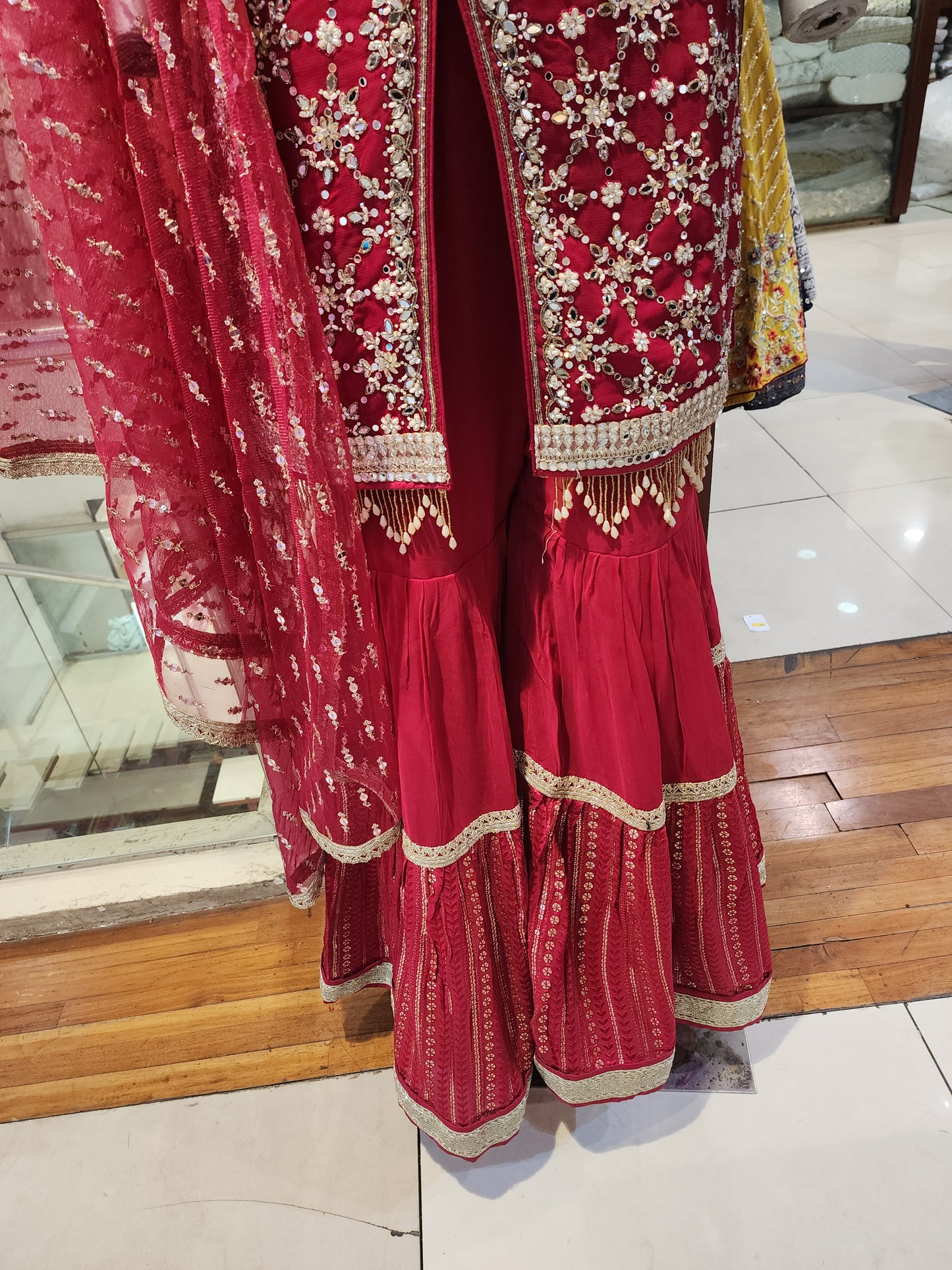 Red georgette mirror work sharara suit and net dupatta