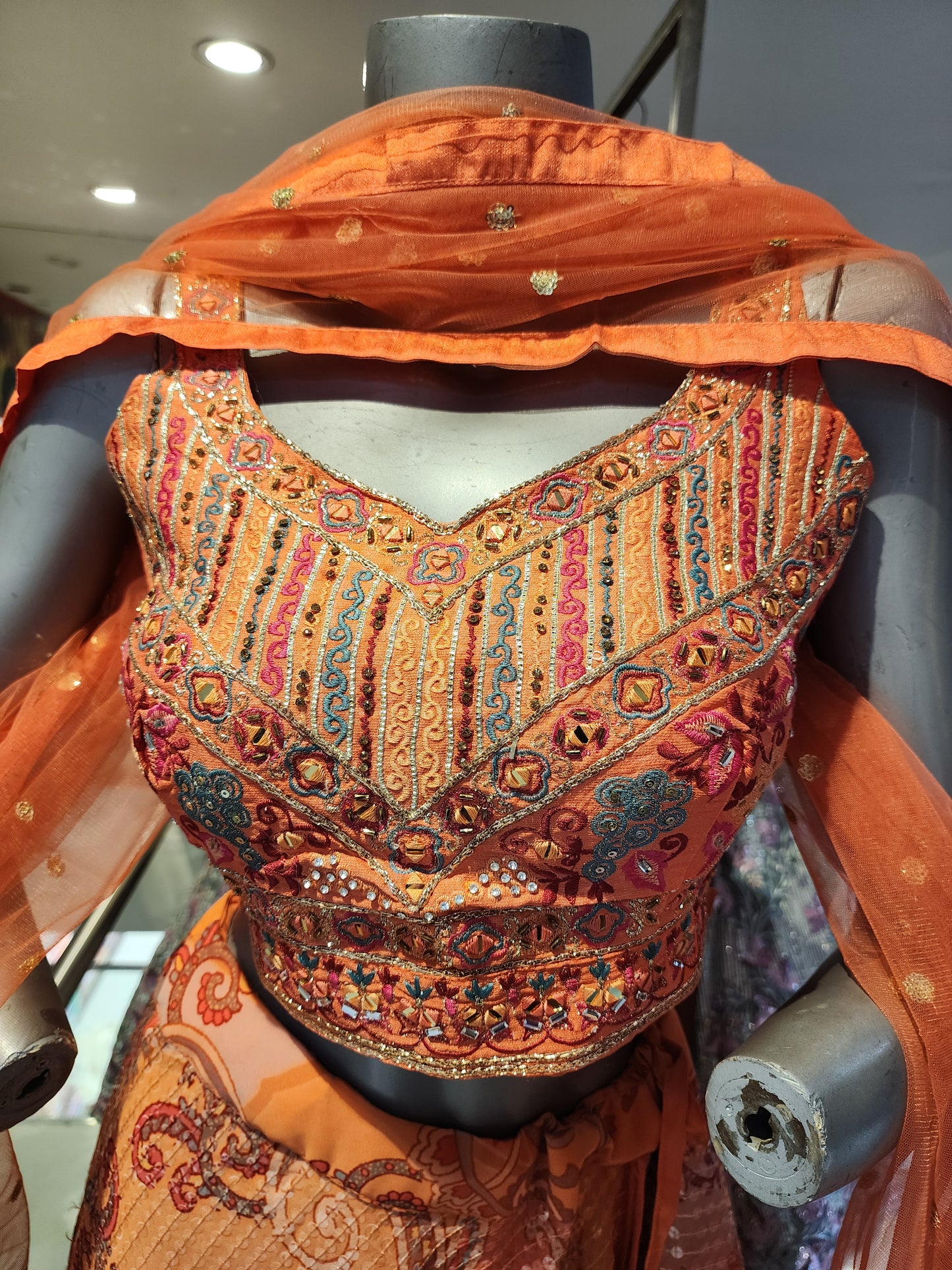 Orange chinon sequins lehenga with embroidered choli ,net dupatta