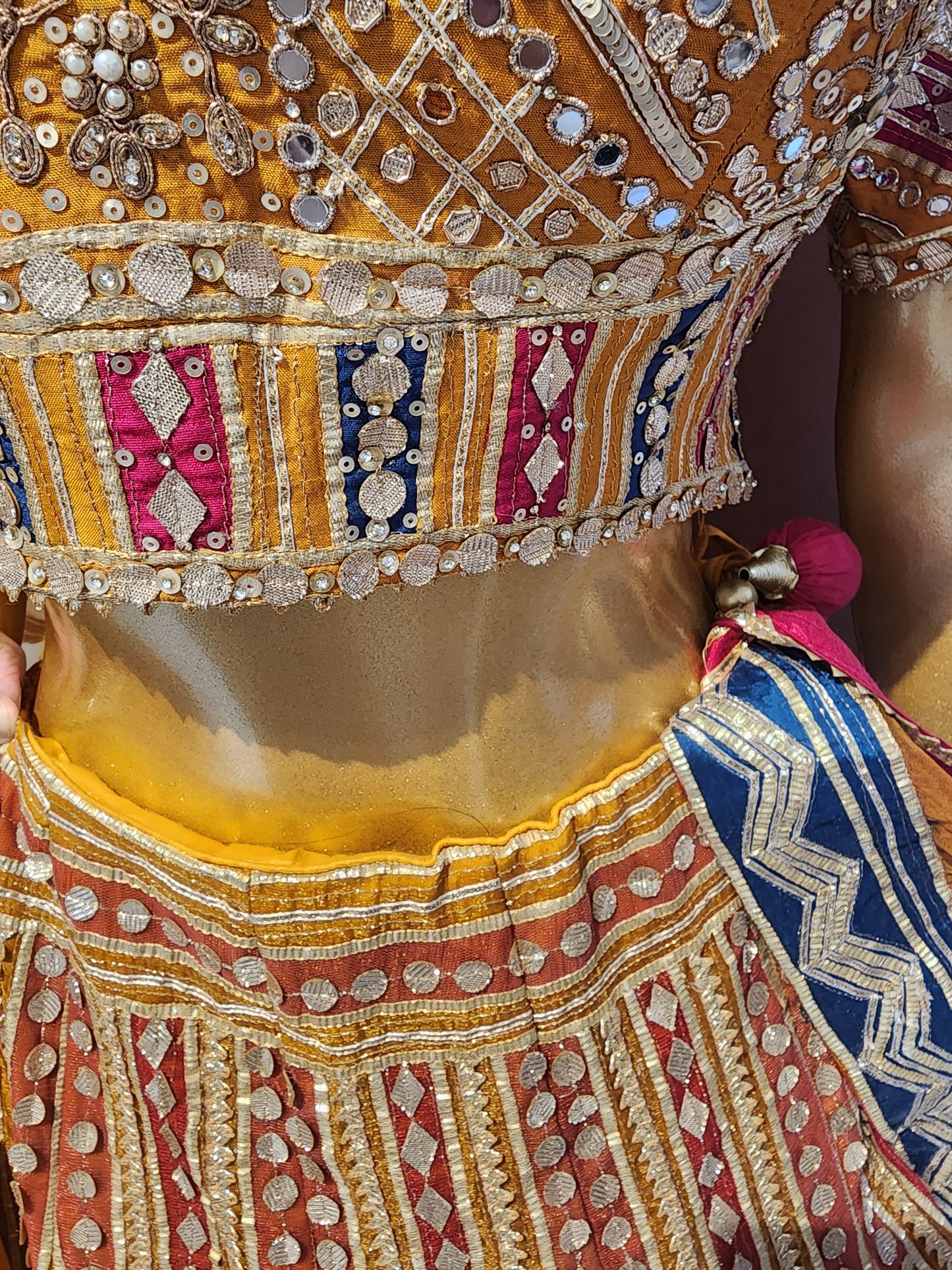 Heavy gota work mustard colour net lehanga with hand work blouse and organza dupatta