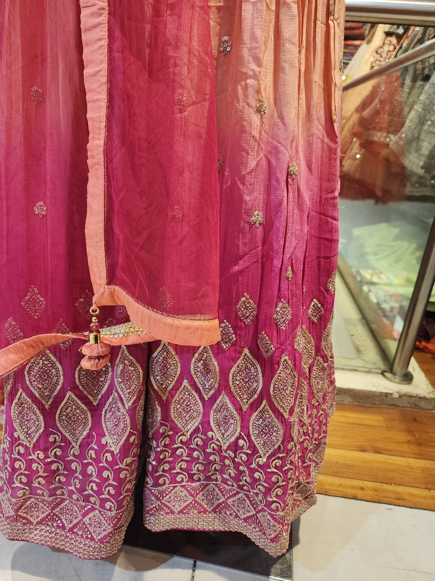 Peach and hot pink colour zari sequins work dress with net dupatta