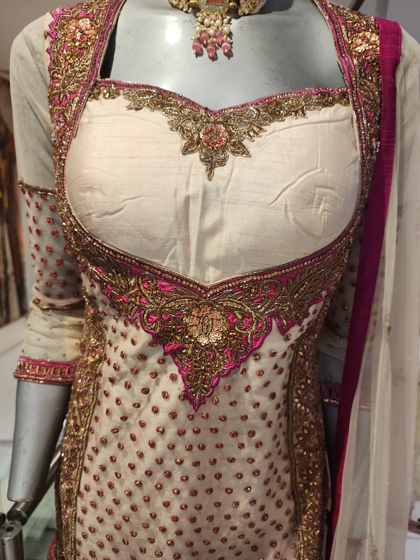 Golden colour net and raw silk heavy antique work garara suit