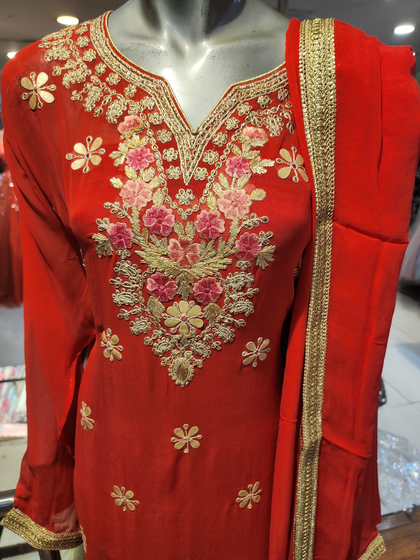 Red colour georgette semi stitch shirt with stitch sharara suit, gota patti + Jari + resham work with georgette dupatta