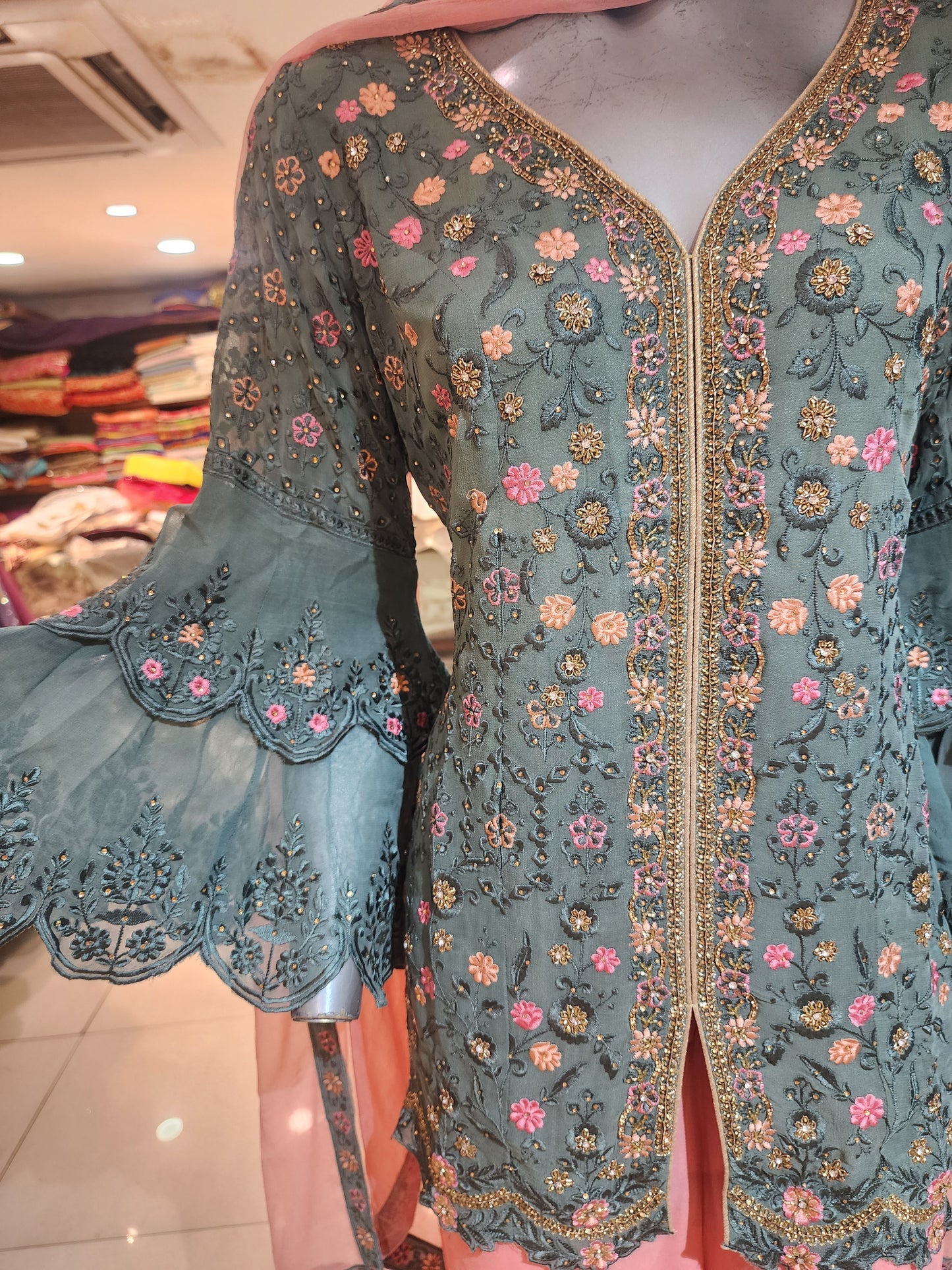 Grey and pink georgette machine and servowski work umbrella sleeves short shirt with garara stitched suit
