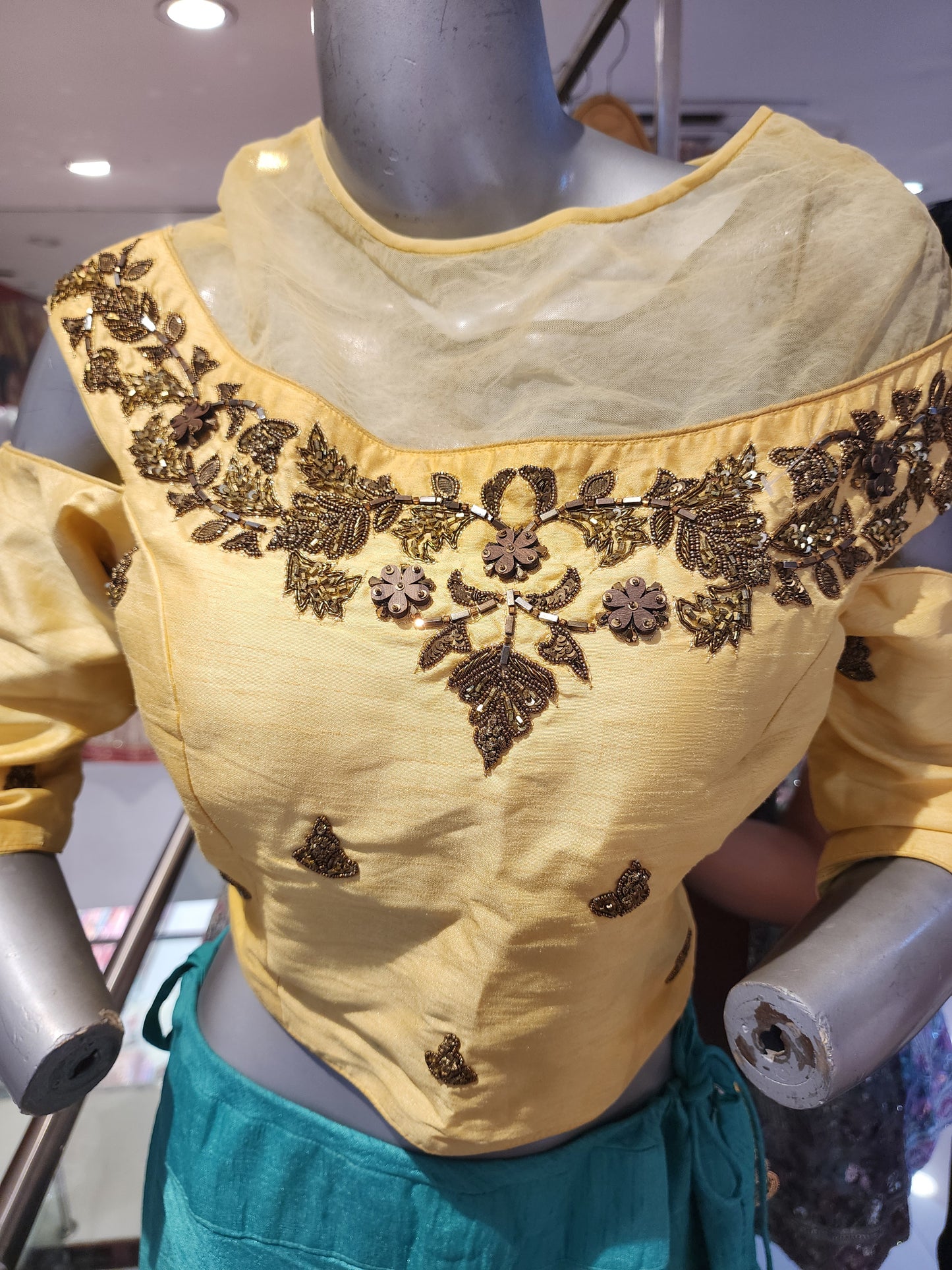 Semi silk firozi lehenga with golden choli