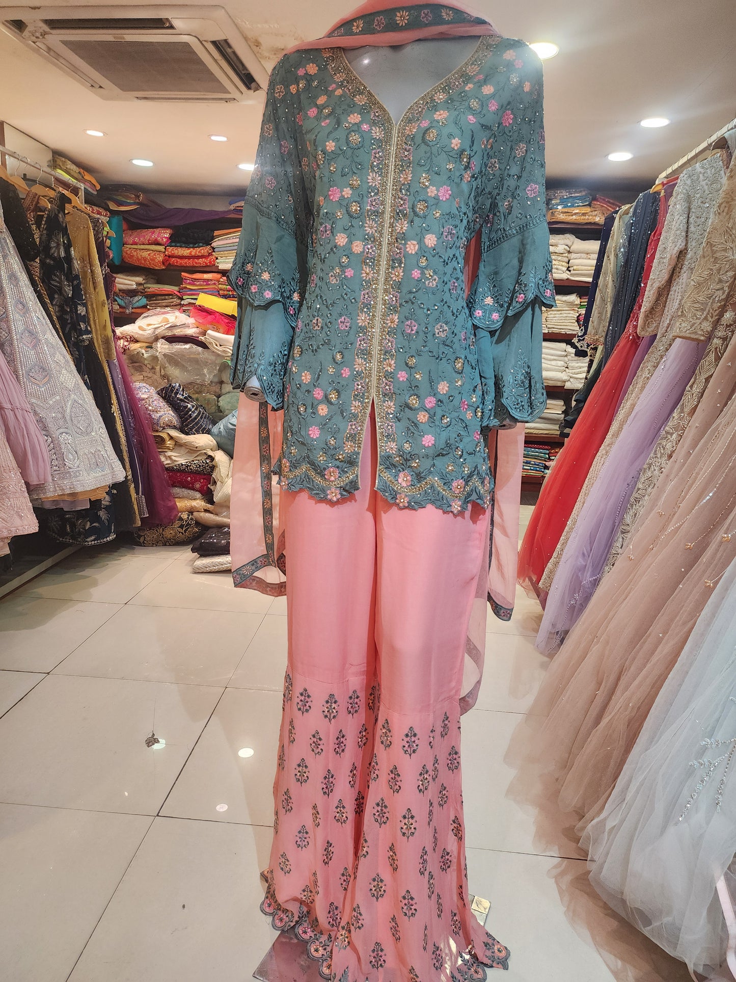 Grey and pink georgette machine and servowski work umbrella sleeves short shirt with garara stitched suit