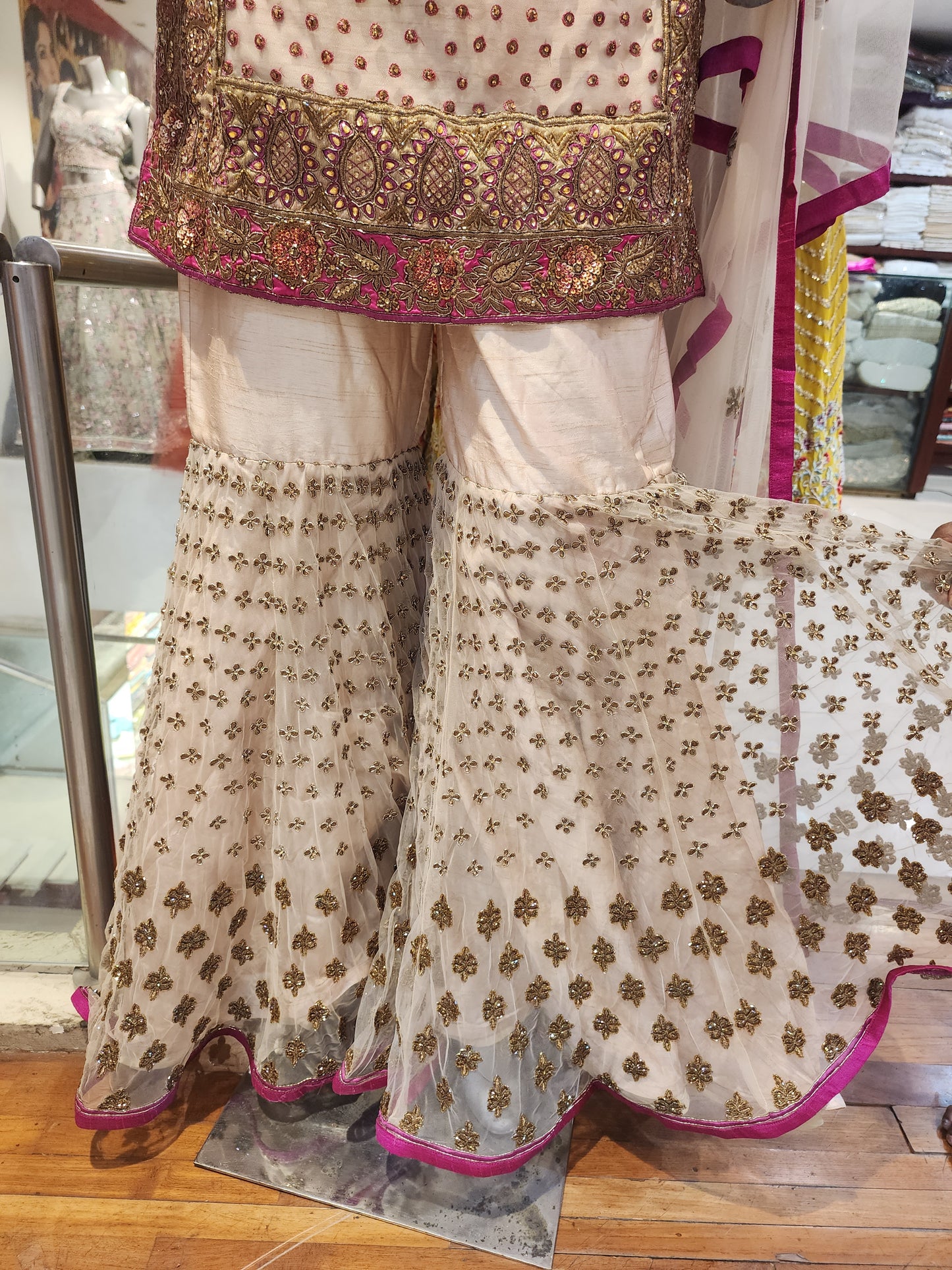 Golden colour net and raw silk heavy antique work garara suit