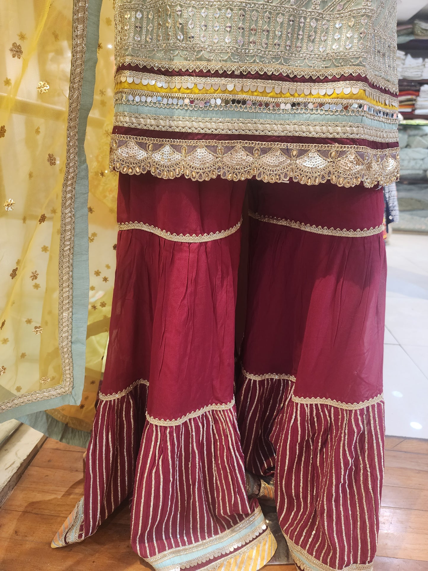 Pista Green georgette shirt Meroon colour garara with yellow net dupatta , hand embroidered neck and machine work
