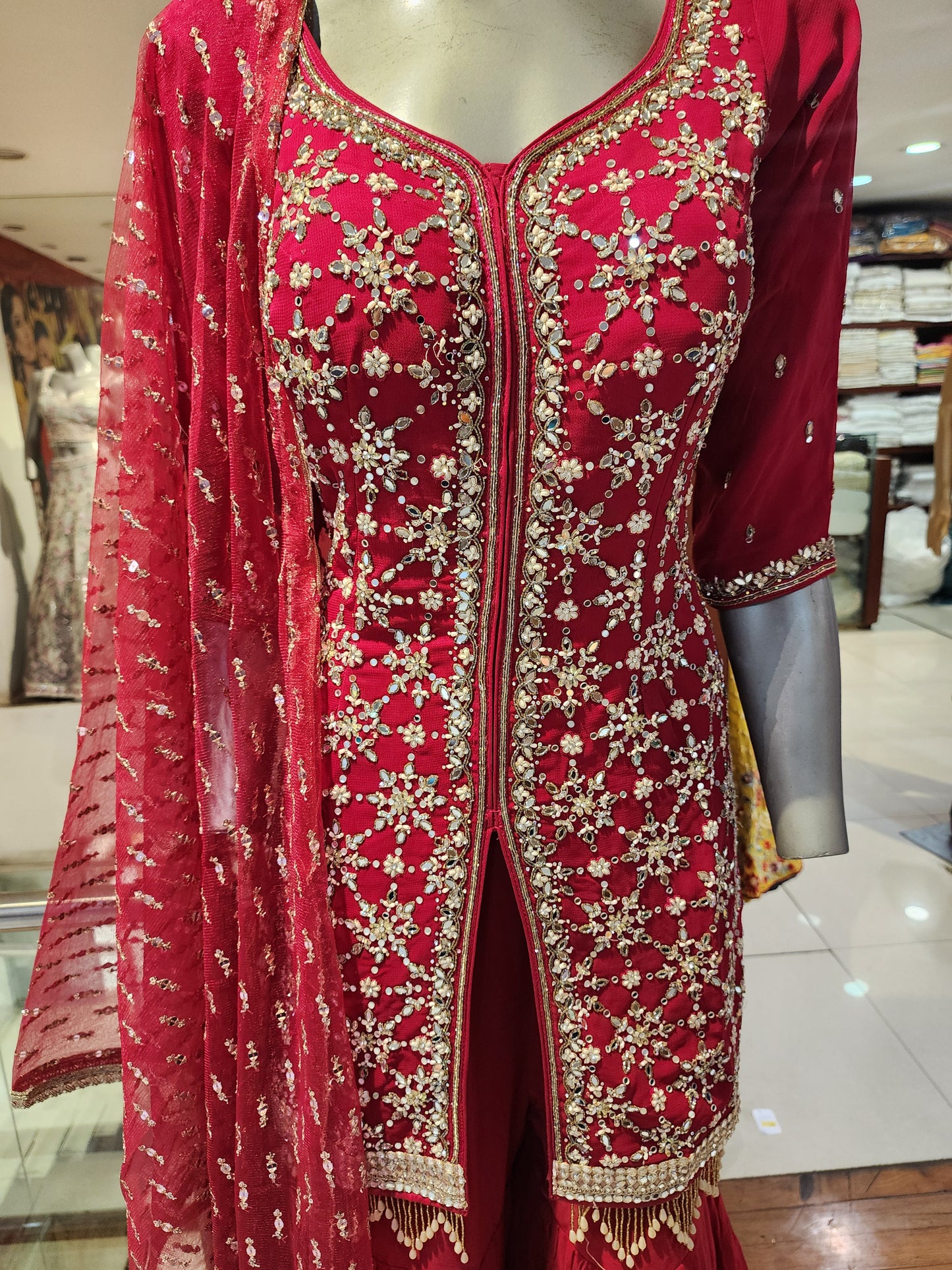 Red georgette mirror work sharara suit and net dupatta
