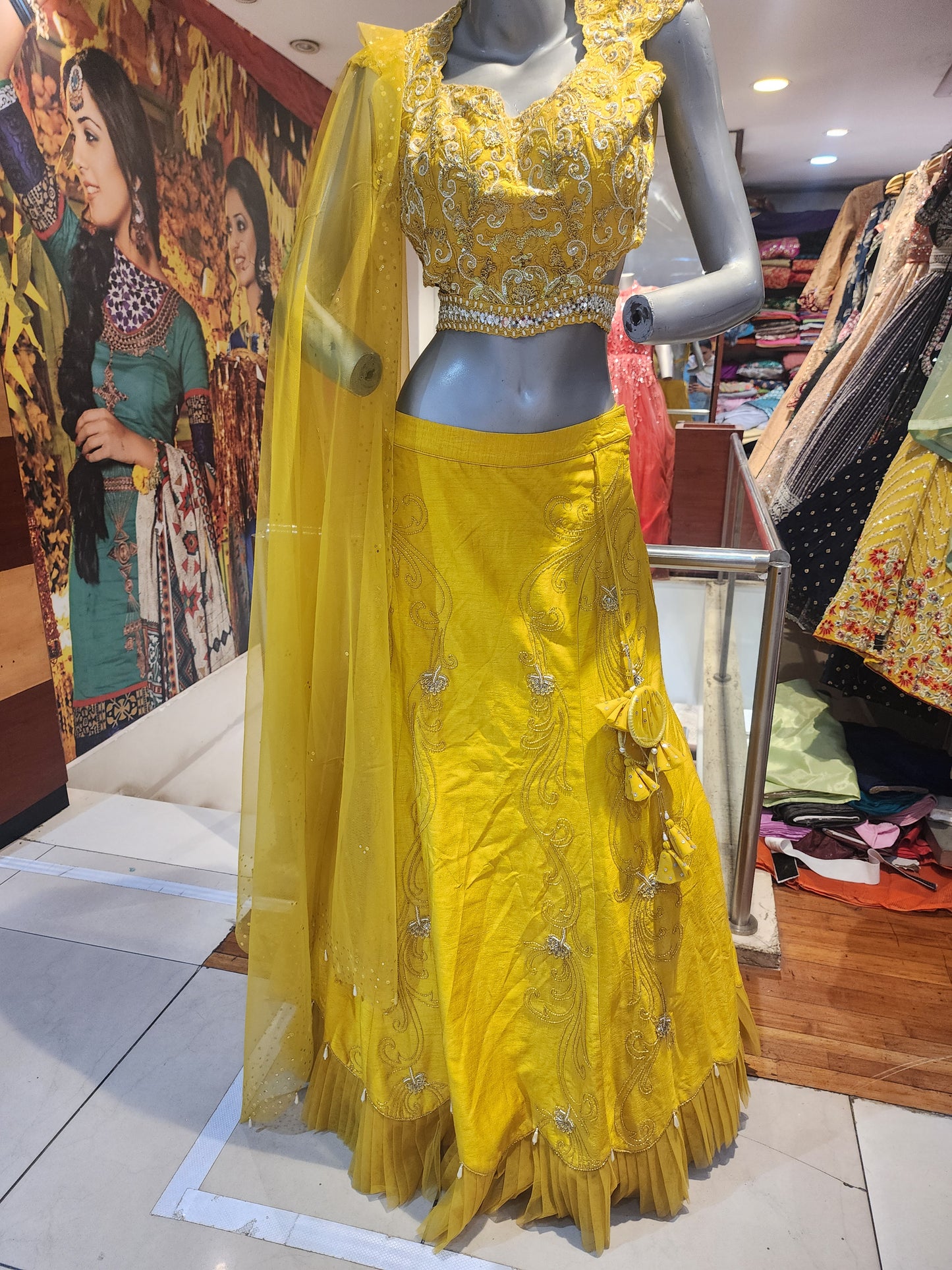 Yellow  colour raw silk lahanga with net frill  , hand work blouse, cut dana + pearl+ sequins + mirror work , with net dupatta