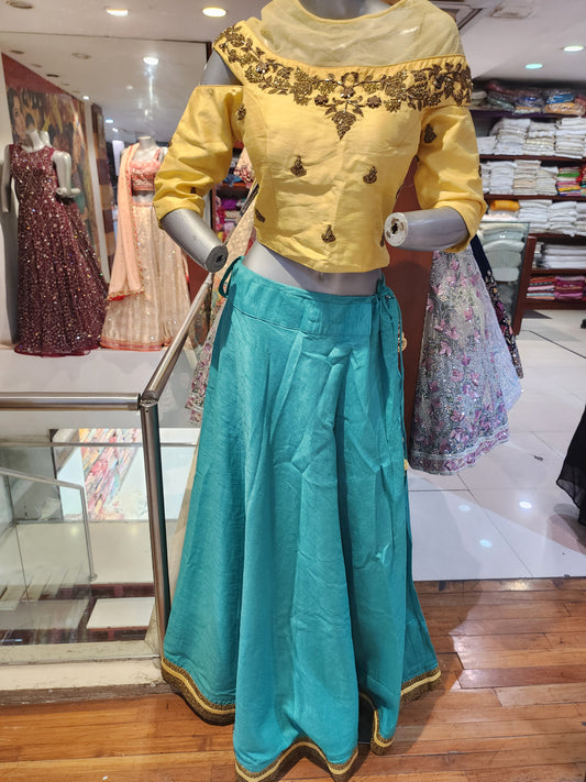 Semi silk firozi  lehenga with golden choli