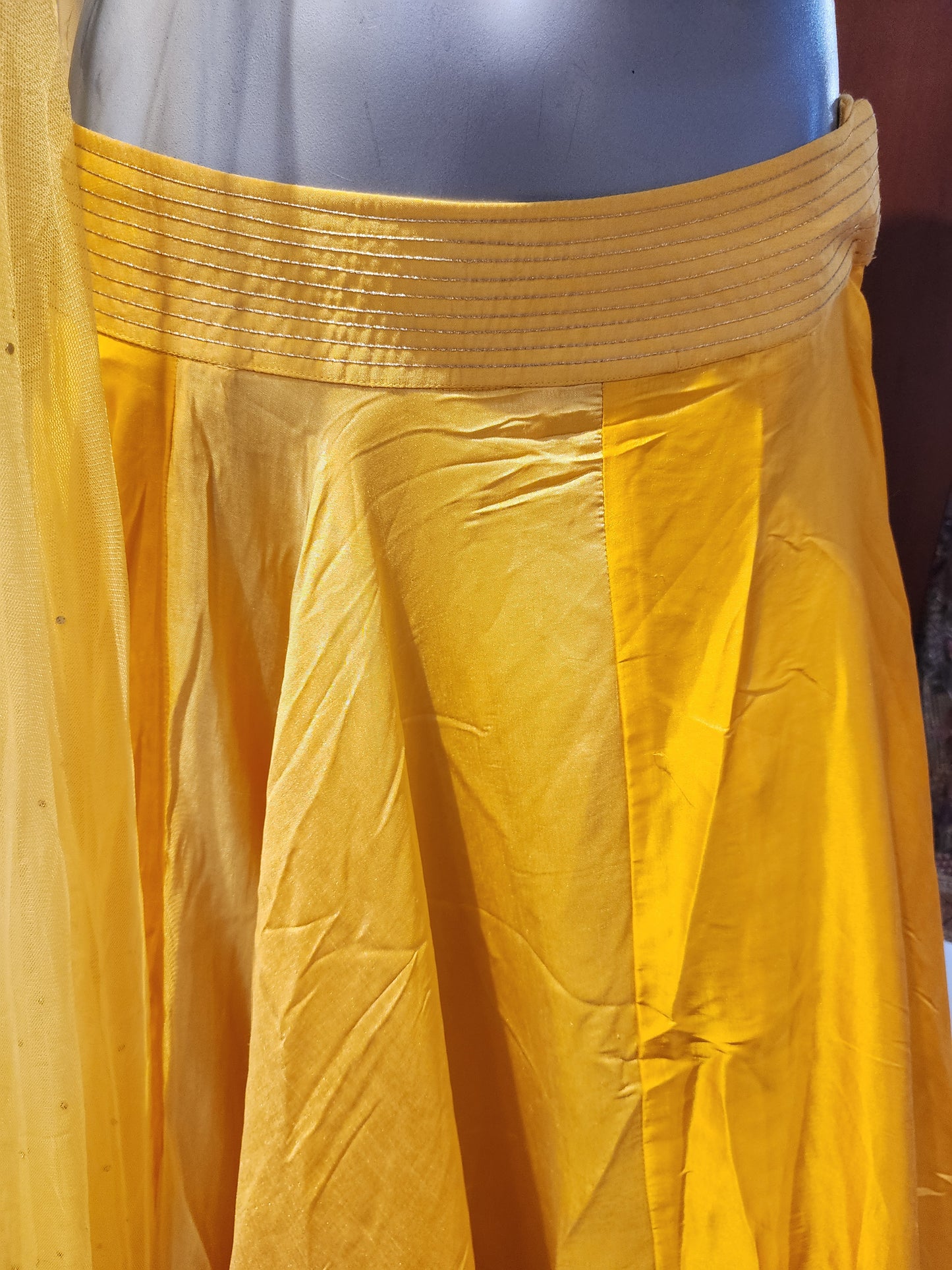 Yellow  silk lehenga  choli with patch work net drape one shoulder