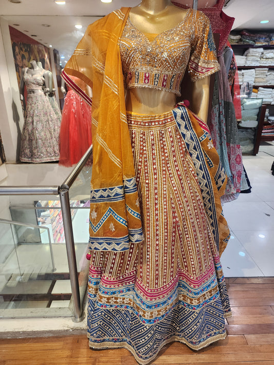 Heavy gota work mustard  colour net lehanga with hand work blouse and organza dupatta