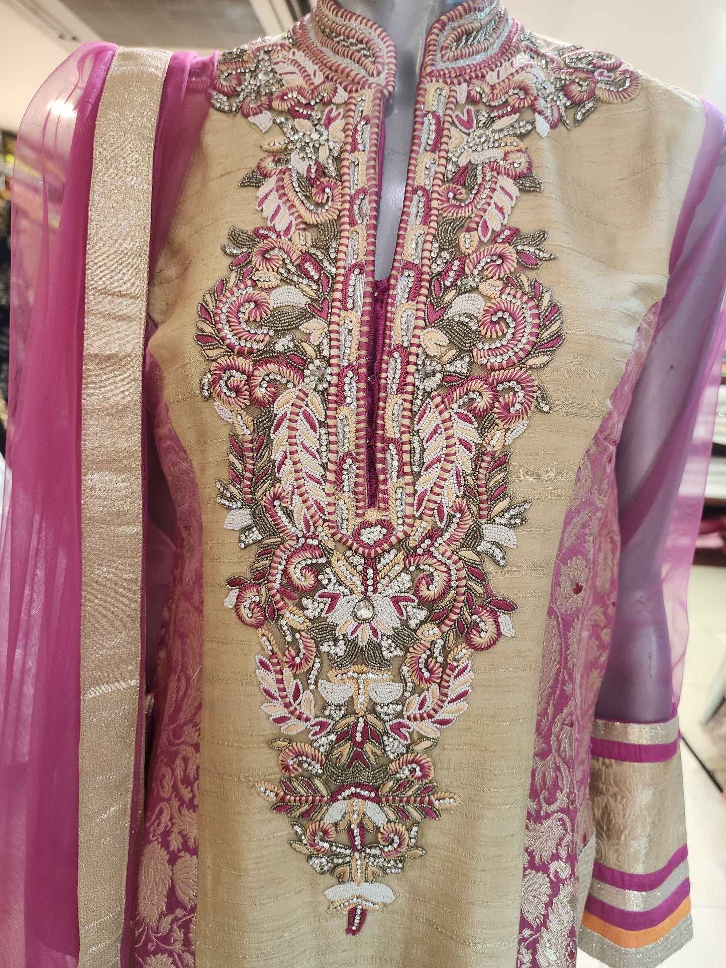 Golden and pink raw silk patch work stitch suit with net dupatta