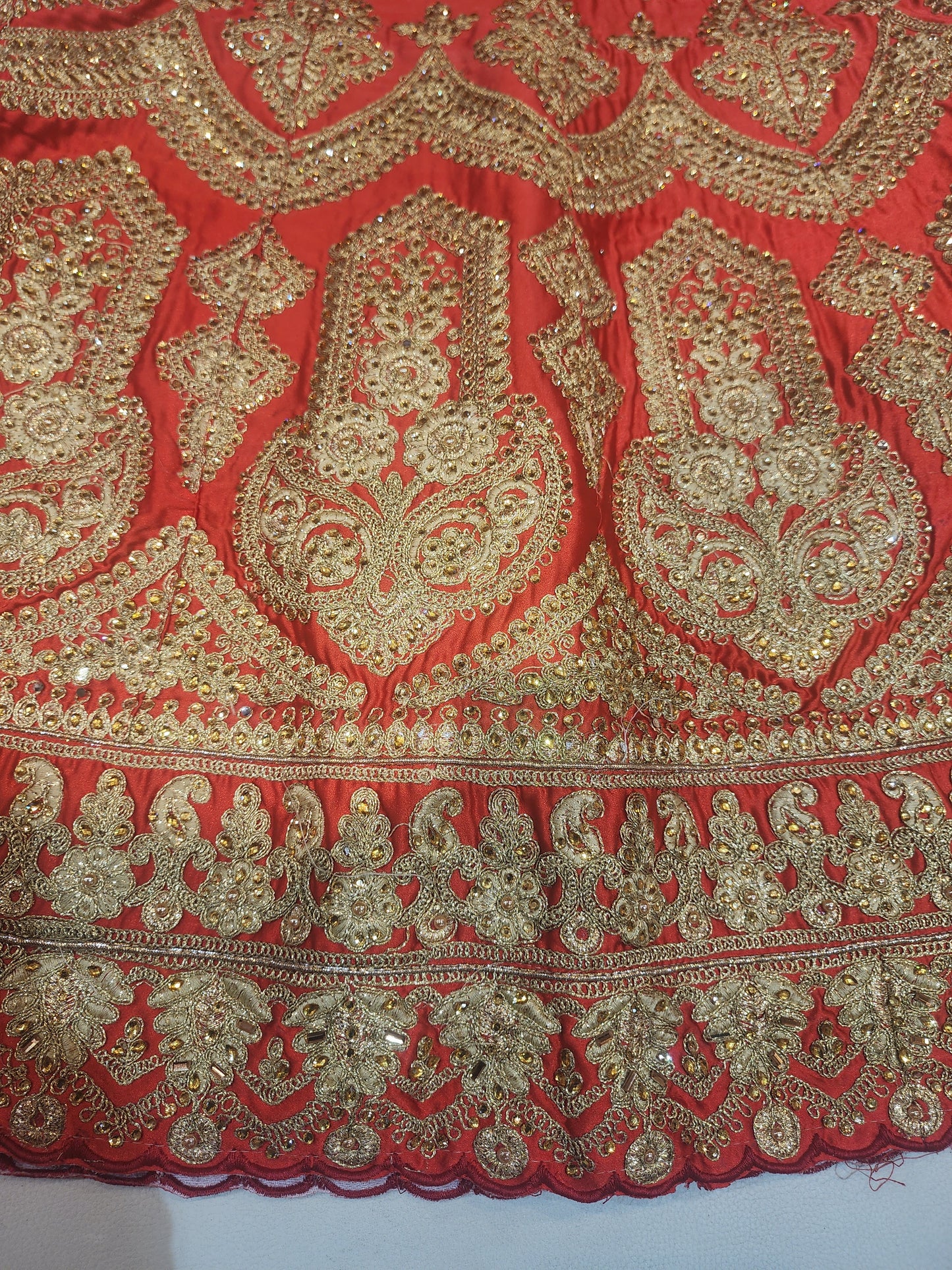 Red colour pure satin lahanga ,zari and kundan work