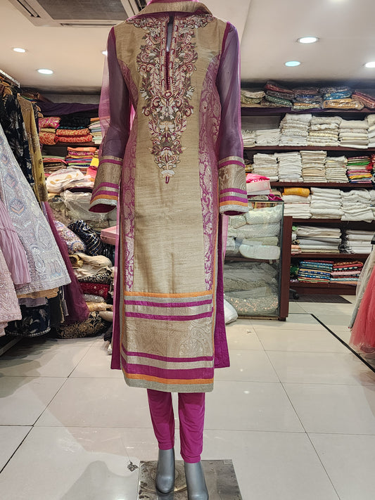 Golden and pink raw silk patch work stitch suit with net dupatta