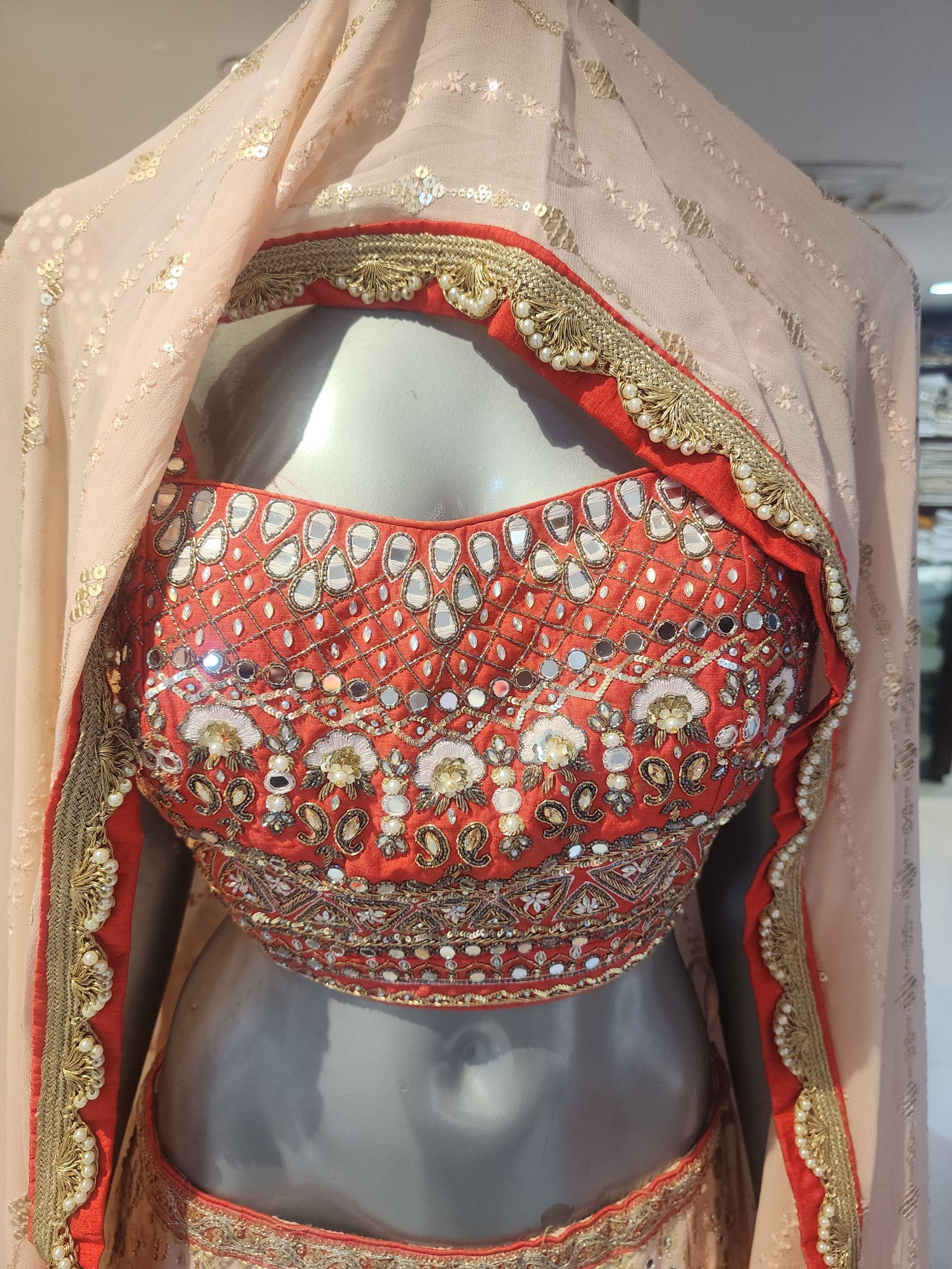 Peach Banarsi lehanga mirror + stone work , Red hand work resham + cut dana+ stone + mirror work blouse with georgette  dupatta