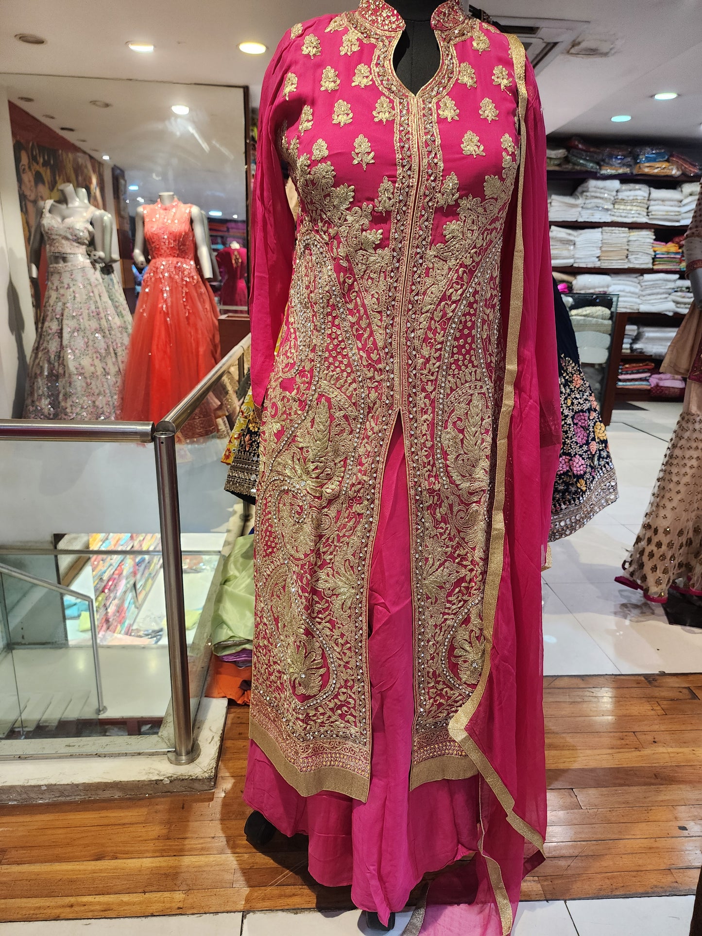 Pink colour achkan style suit with plazo band neck kunden work and all over aari work