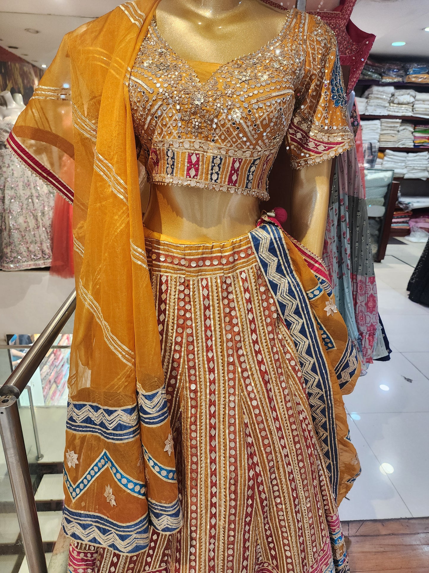 Heavy gota work mustard  colour net lehanga with hand work blouse and organza dupatta