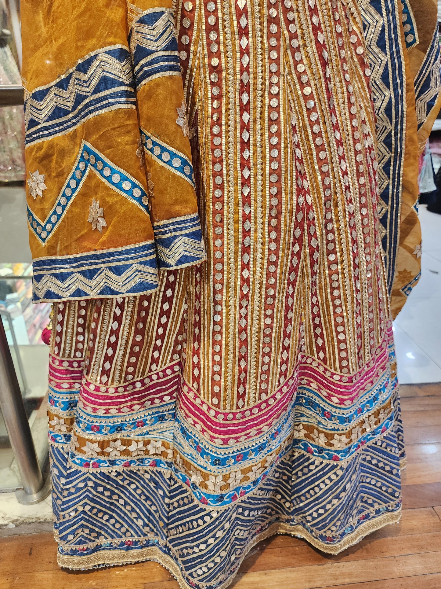 Heavy gota work mustard  colour net lehanga with hand work blouse and organza dupatta