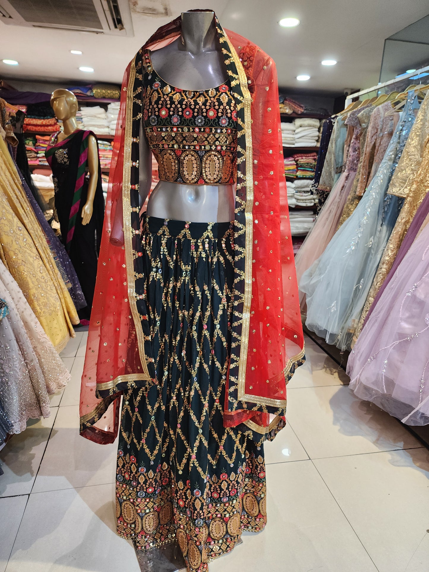 Bottle green fabrication sequins lehanga with Red colour net dupatta gota border
