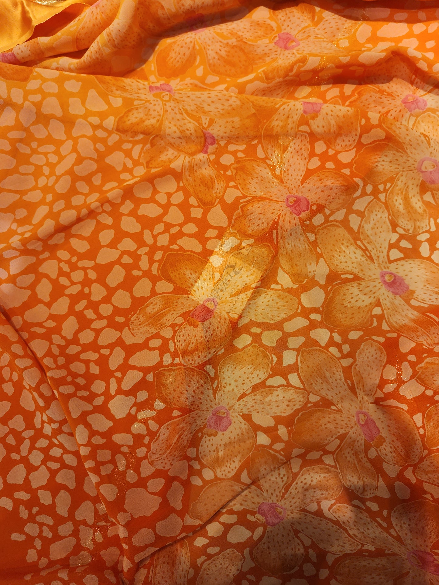 Georgette orange saree with Satin border in shaded . Printed blouse and pallu