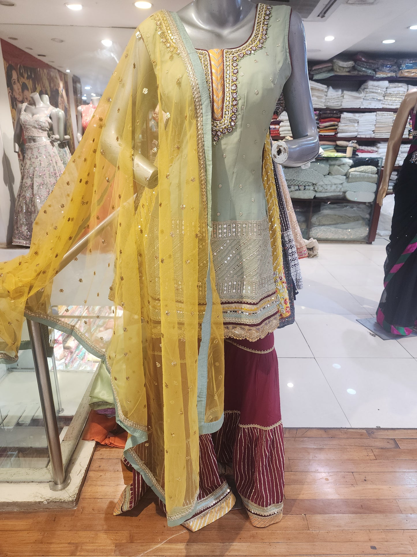 Pista Green georgette  shirt Meroon colour garara with yellow net dupatta , hand embroidered  neck and machine  work