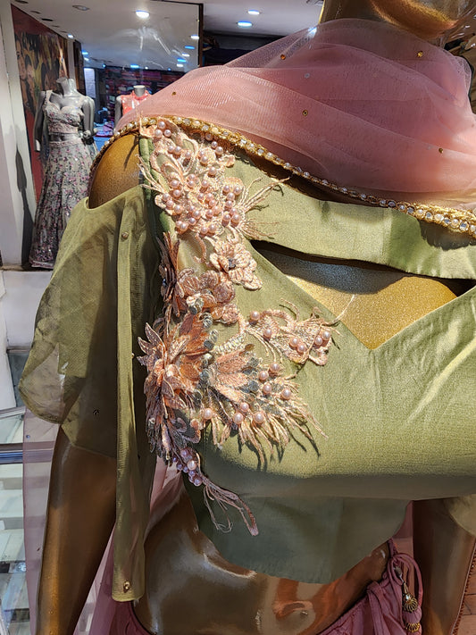Peach colour pure silk lahanga with pista green colour blouse with patch work, net dupatta