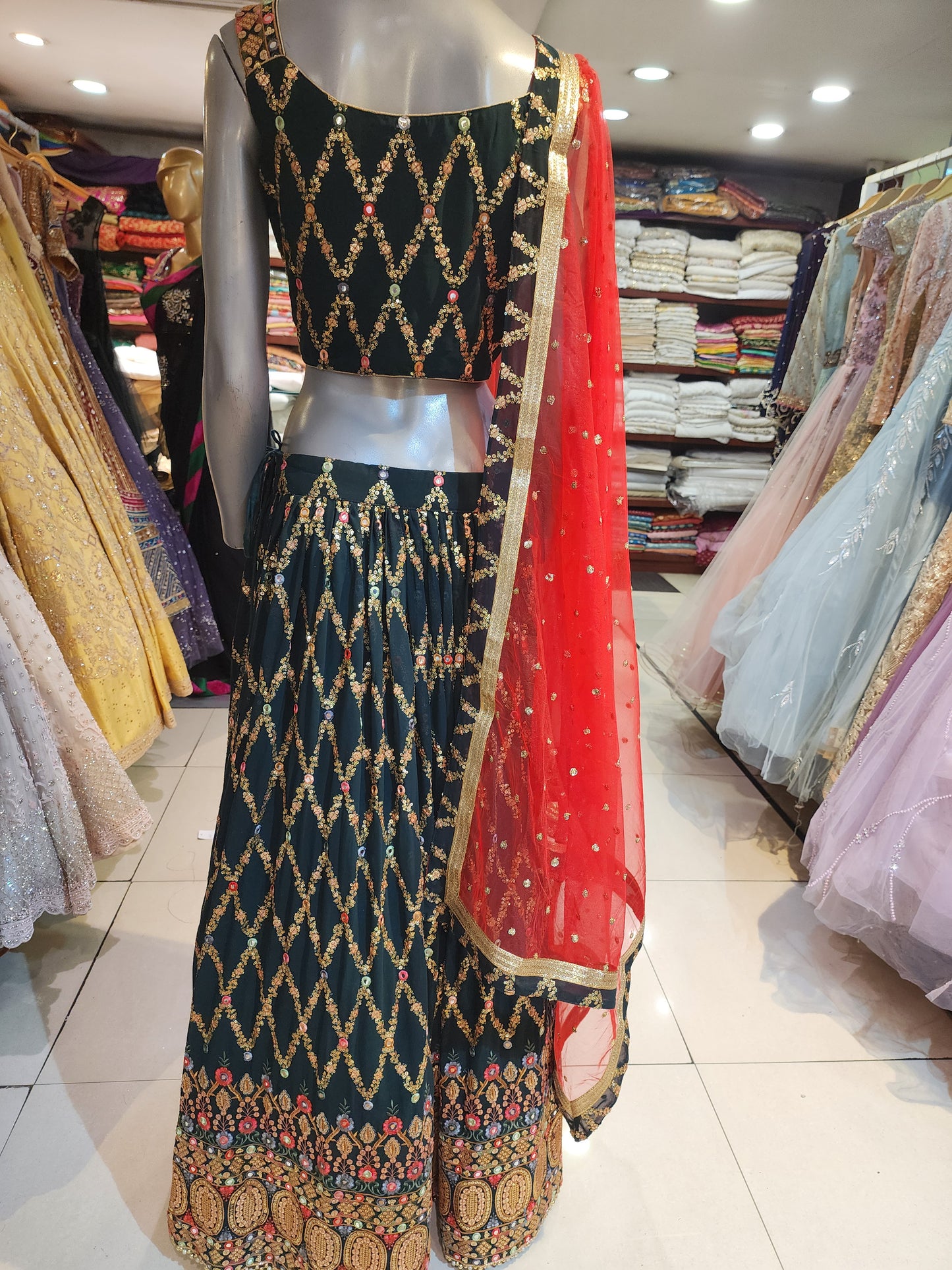Bottle green fabrication sequins lehanga with Red colour net dupatta gota border