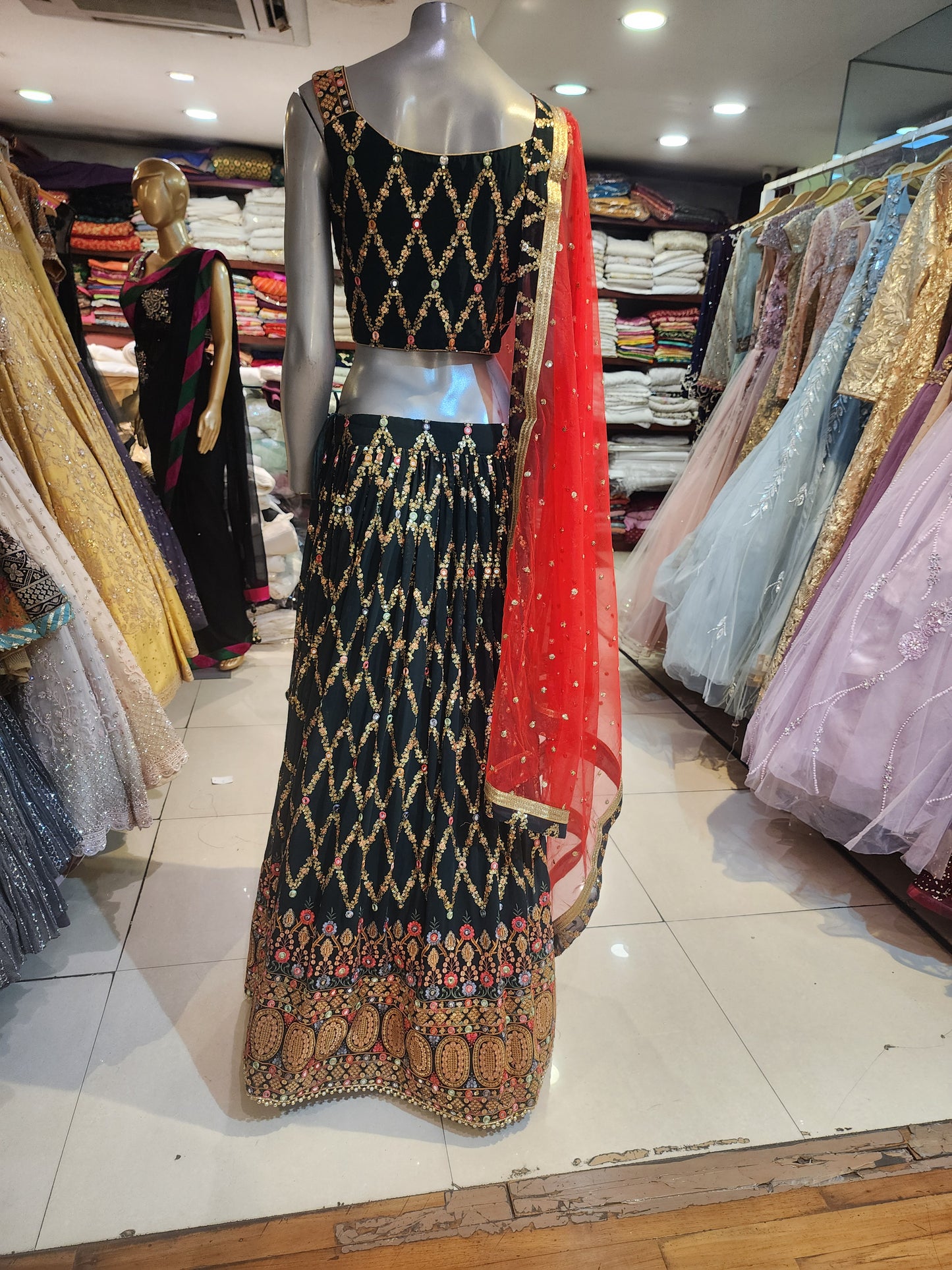 Bottle green fabrication sequins lehanga with Red colour net dupatta gota border