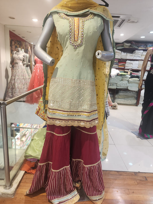 Pista Green georgette  shirt Meroon colour garara with yellow net dupatta , hand embroidered  neck and machine  work
