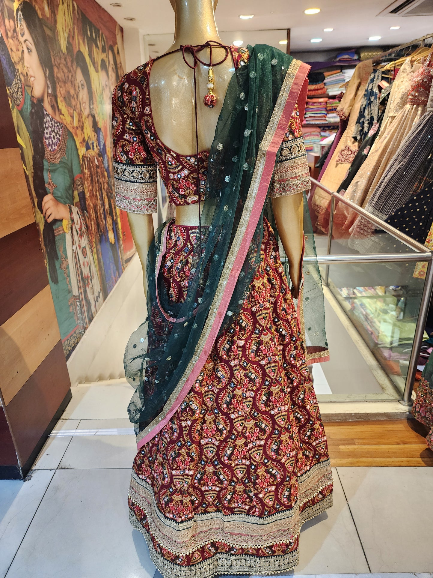 Maroon georgette  multicolored work + zari border with net dupatta